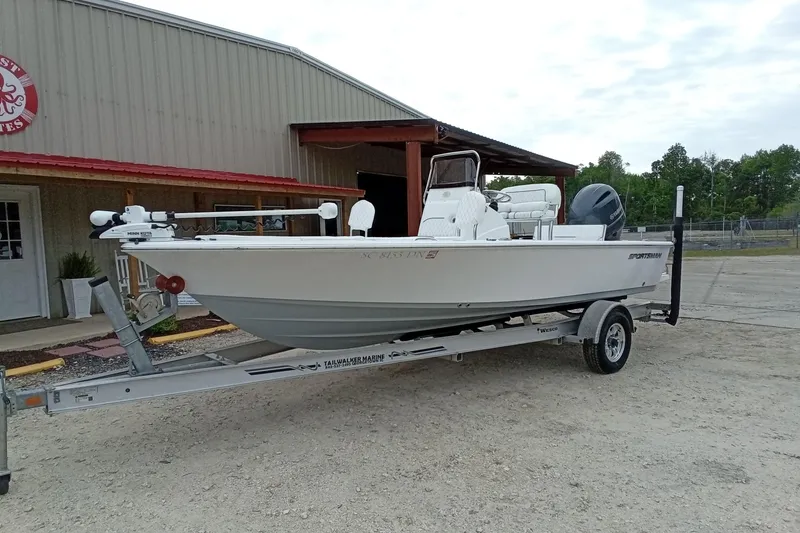 Slide: The Image of 2021 Sportsman Masters 207 Bay Boat on trailer outside a building. - 3
