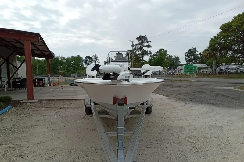 Slide: The Image of 2021 Sportsman Masters 207 Bay Boat on trailer, parked outdoors. - 4