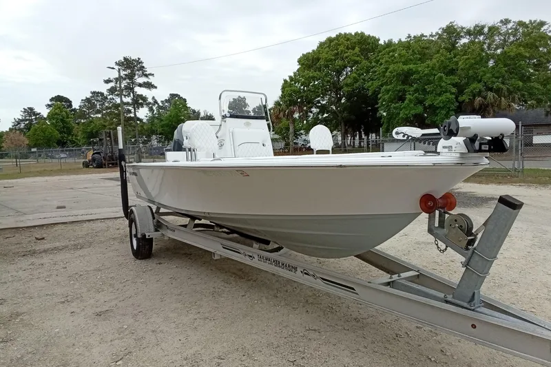 Slide: The Image of 2021 Sportsman Masters 207 Bay Boat on trailer, parked outdoors. - 6