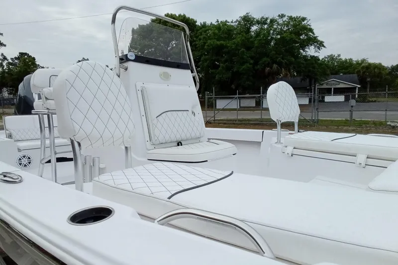 Slide: The Image of 2021 Sportsman Masters 207 Bay Boat with white quilted seating and sleek design. - 7