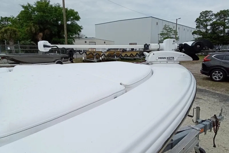 Slide: The Image of 2021 Sportsman Masters 207 Bay Boat with Minn Kota Terrova trolling motor in a parking area. - 8