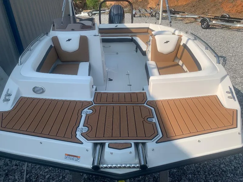 Slide: The Image of 2024 Starcraft SVX 191 OB boat with brown seating and deck. - 11