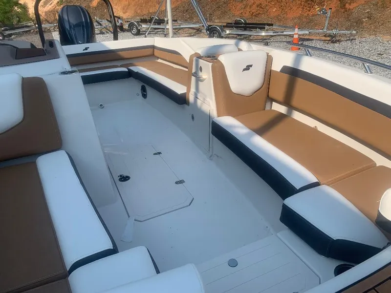 Slide: The Image of 2024 Starcraft SVX 191 OB interior with brown and white seating. - 12