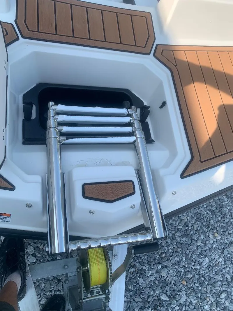 Slide: The Image of 2024 Starcraft SVX 191 OB boat with retractable swim ladder. - 13