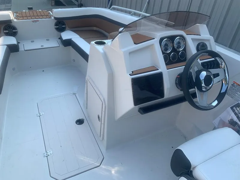 Slide: The Image of Interior view of 2024 Starcraft SVX 191 OB boat with helm console. - 14
