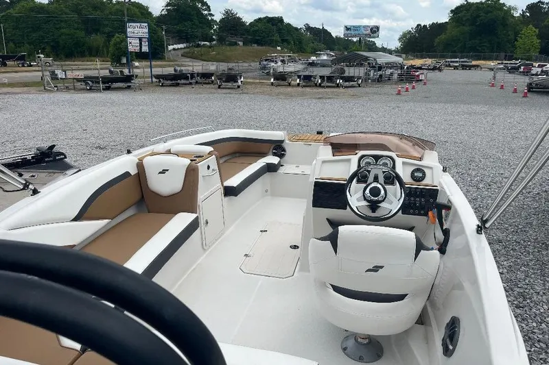 Slide: The Image of 2024 Starcraft SVX 191 OB boat interior with modern seating and steering console. - 16