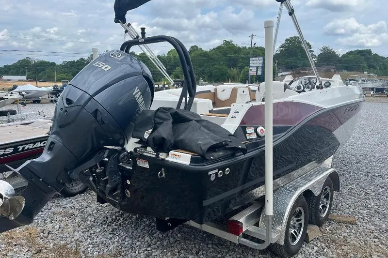 Slide: The Image of 2024 Starcraft SVX 191 OB boat with Yamaha outboard motor on a trailer. - 2