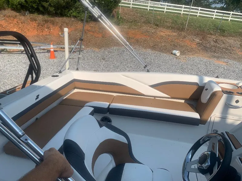 Slide: The Image of Interior of 2024 Starcraft SVX 191 OB boat with beige and white seating. - 8