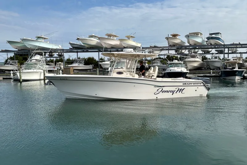 The Image of 2016 Grady-White Canyon 306 boat named "Jenny M" docked in a marina. - 0