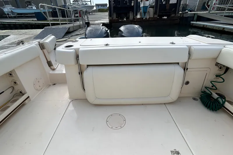 Slide: The Image of 2016 Grady-White Canyon 306 boat interior with seating and dock view. - 13
