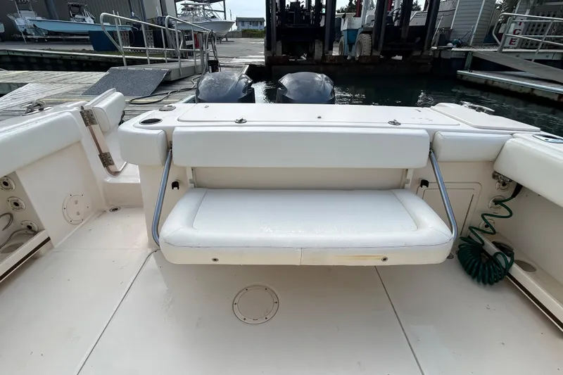 Slide: The Image of 2016 Grady-White Canyon 306 boat with foldable rear seat at dock. - 14