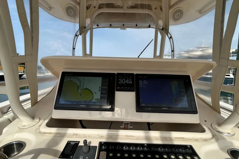 Slide: The Image of Dashboard of 2016 Grady-White Canyon 306 boat with navigation screens. - 19