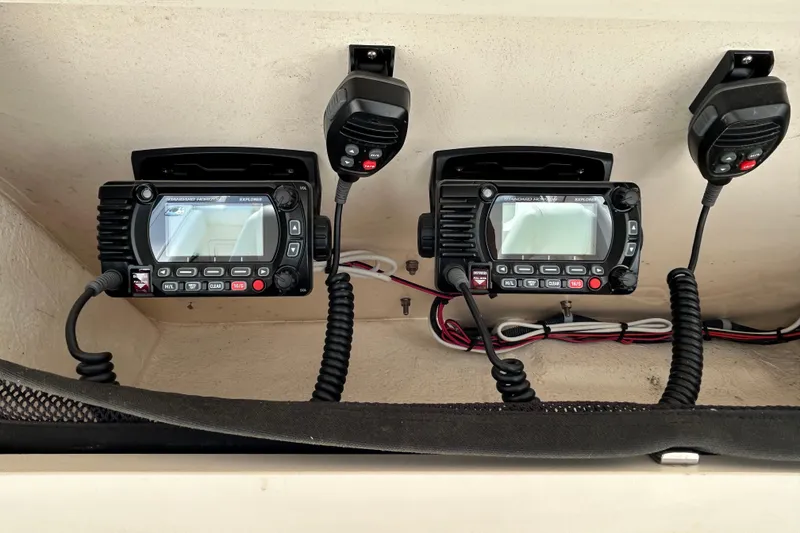 Slide: The Image of Dual marine radios with microphones on a 2016 Grady-White Canyon 306 boat. - 22