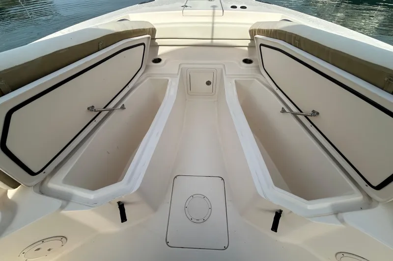 Slide: The Image of 2016 Grady-White Canyon 306 boat interior with open storage compartments. - 28