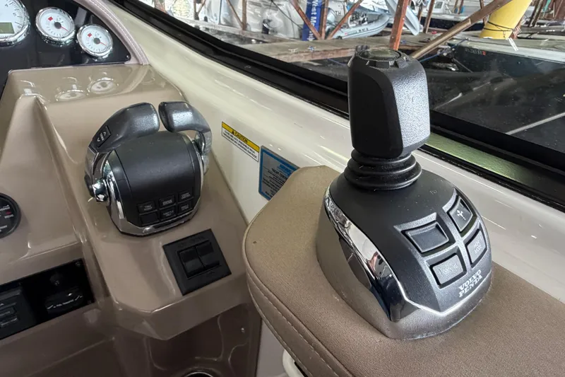 Slide: The Image of Control panel of a 2016 Regal 35 Sport Coupe boat with joystick and throttle. - 20