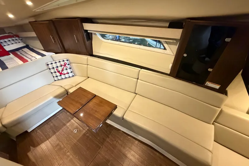 Slide: The Image of Luxurious interior of 2016 Regal 35 Sport Coupe with beige seating and wooden accents. - 22