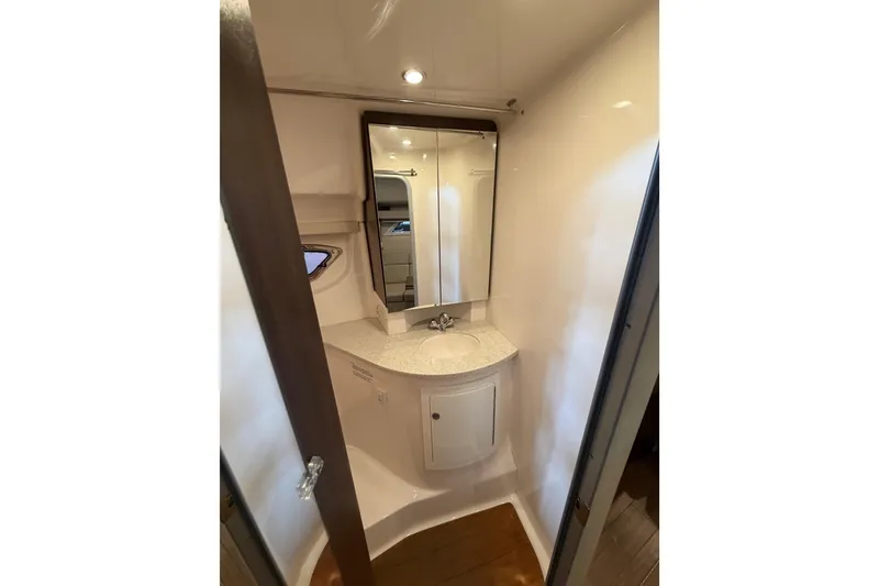 Slide: The Image of 2016 Regal 35 Sport Coupe bathroom with modern sink, mirror, and storage cabinet. - 24