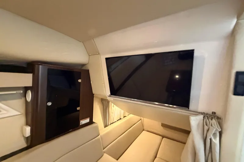Slide: The Image of Interior of 2016 Regal 35 Sport Coupe with TV and seating area. - 28