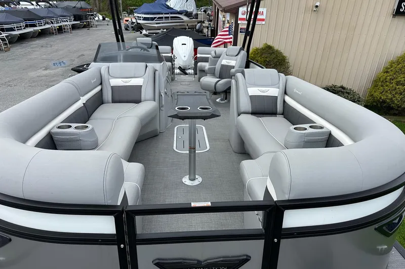 Slide: The Image of 2024 Bennington LX Sport Line pontoon boat with luxurious seating and modern design. - 14