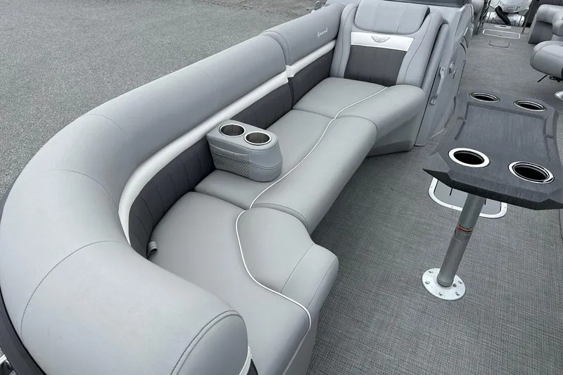 Slide: The Image of 2024 Bennington LX Sport Line boat interior with gray seating and cup holders. - 15