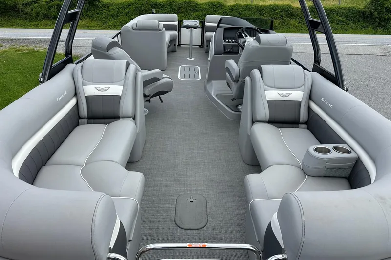 Slide: The Image of 2024 Bennington LX Sport Line pontoon boat interior with luxurious gray seating and modern design. - 21