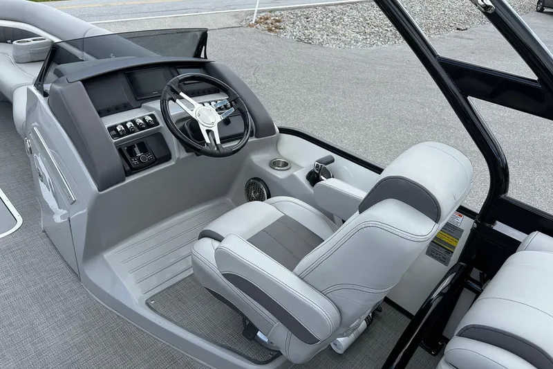 Slide: The Image of 2024 Bennington LX Sport Line boat interior with sleek helm and comfortable seating. - 22