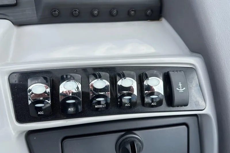 Slide: The Image of Dashboard switches of a 2024 Bennington LX Sport Line boat. - 25