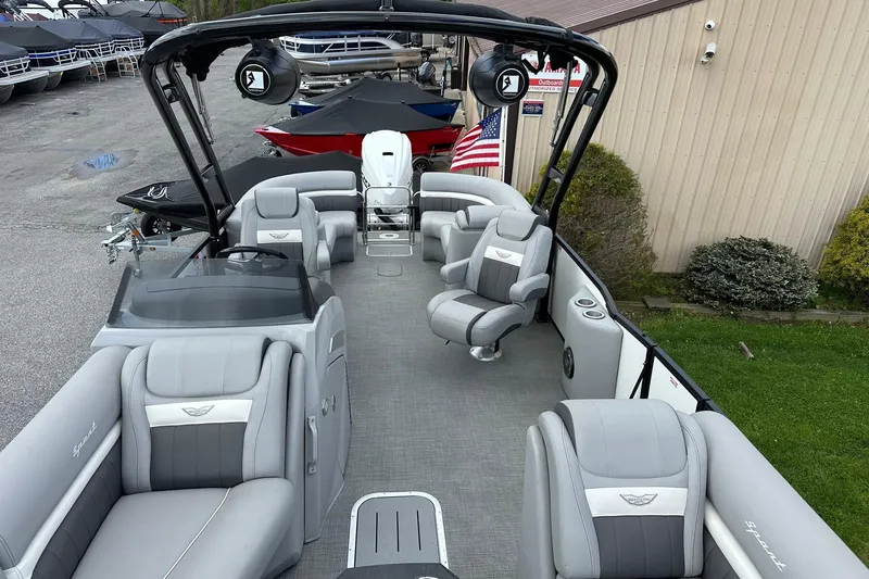 Slide: The Image of 2024 Bennington LX Sport Line pontoon boat with luxurious seating and modern design. - 31