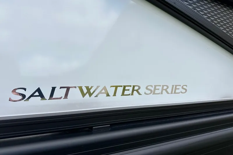 Slide: The Image of 2024 Bennington LX Sport Line Saltwater Series logo on boat exterior. - 35