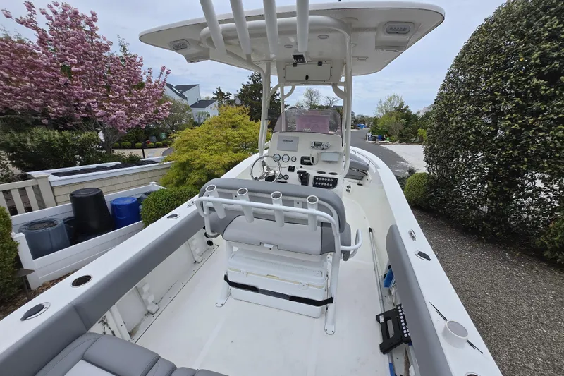 Slide: The Image of 2021 NauticStar 2302 Legacy boat interior with seating and control panel. - 1