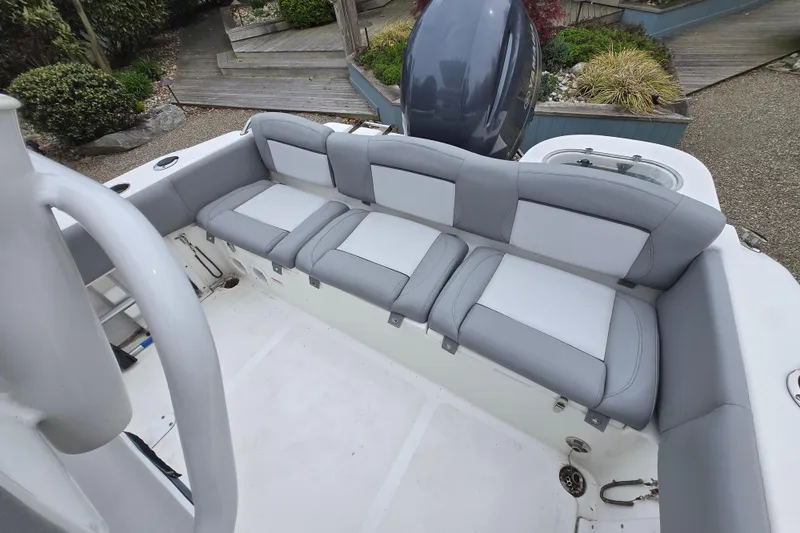 Slide: The Image of 2021 NauticStar 2302 Legacy boat with spacious seating and sleek design. - 11