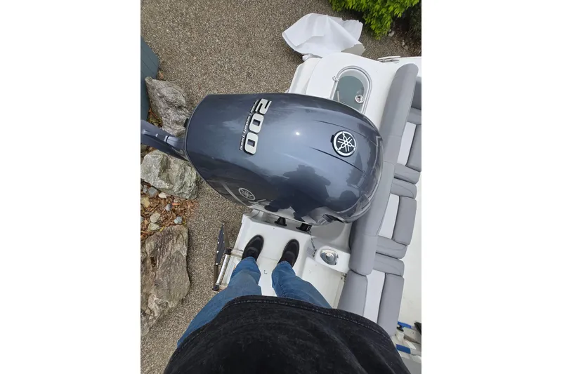 Slide: The Image of 2021 NauticStar 2302 Legacy boat with Yamaha 200 engine, viewed from above. - 25