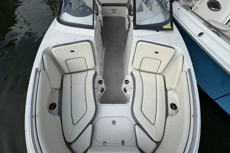 Slide: The Image of 2024 Stingray 211 DC boat interior with spacious seating and modern design. - 21