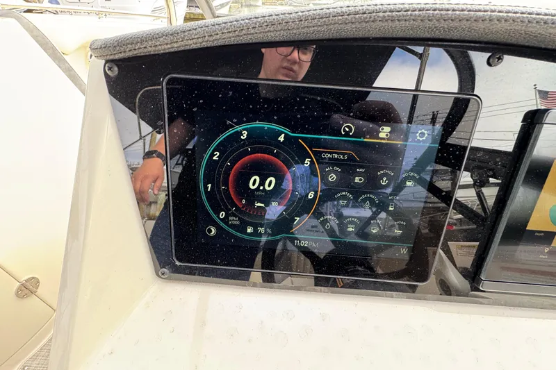 Slide: The Image of Dashboard of 2024 Stingray 211 DC boat with digital controls and display. - 9
