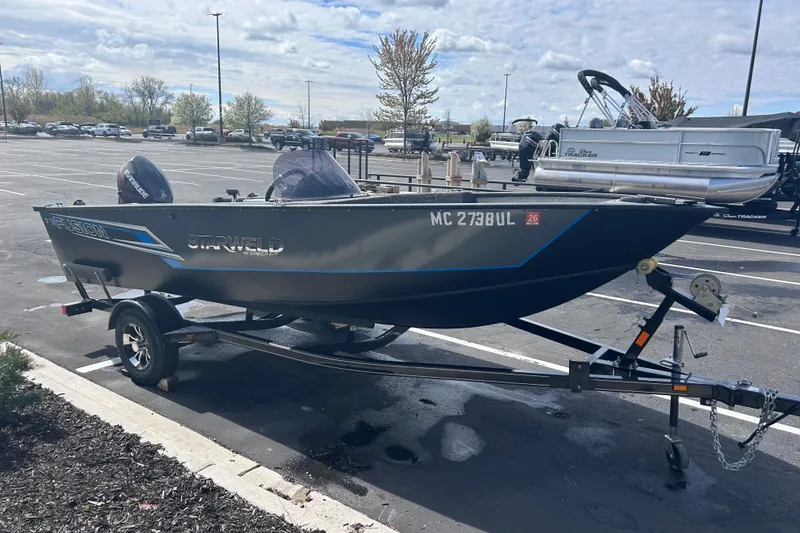 Slide: The Image of Starweld Fusion Pro 16 SC 2019 boat on trailer in parking lot. - 11
