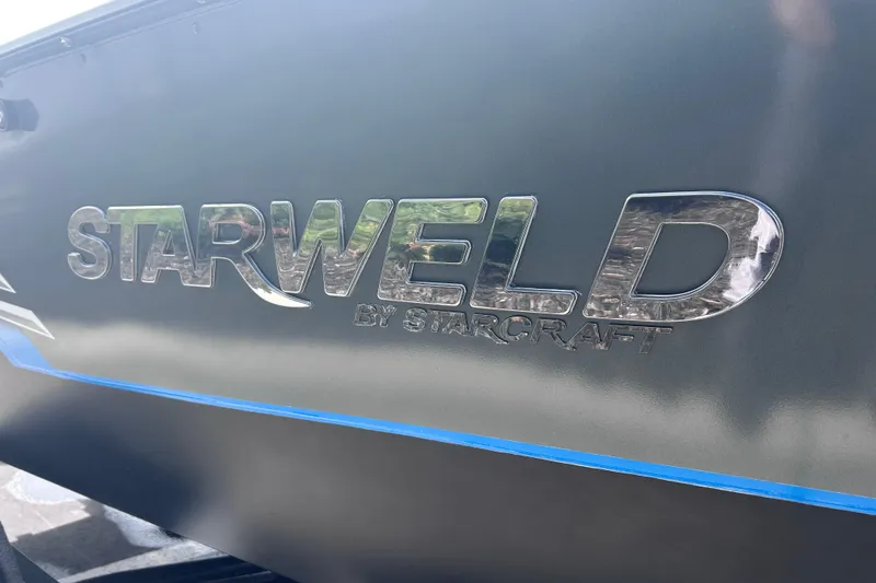 Slide: The Image of Starweld Fusion Pro 16 SC 2019 boat logo on metallic surface. - 12