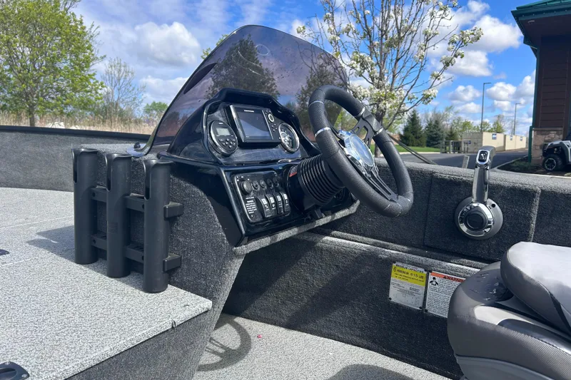 Slide: The Image of 2019 Starweld Fusion Pro 16 SC boat dashboard with steering wheel and control panel. - 15