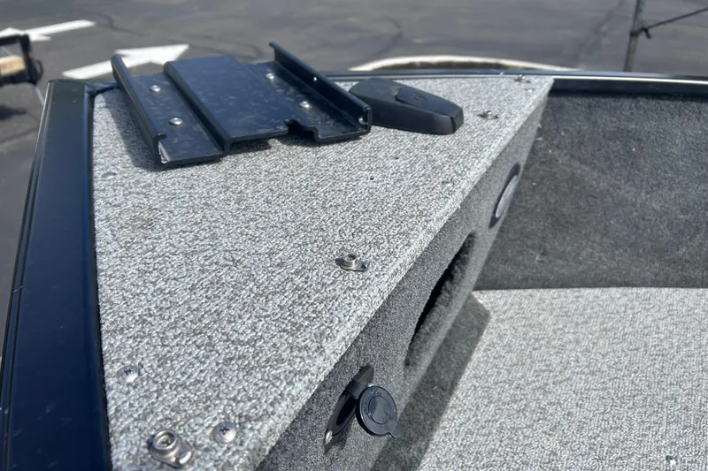 Slide: The Image of 2019 Starweld Fusion Pro 16 SC boat deck with carpeted surface and mounting bracket. - 16