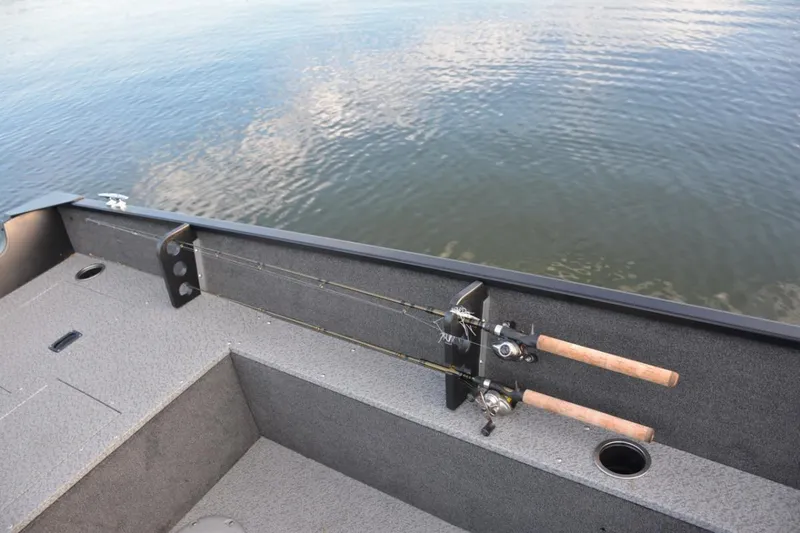 Slide: The Image of Manufacturer Provided Image: 2019 Starweld Fusion Pro 16 SC fishing boat interior with rod holders on calm water. - 28