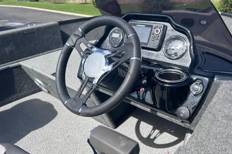 Slide: The Image of Steering console of 2019 Starweld Fusion Pro 16 SC boat with gauges and controls. - 8