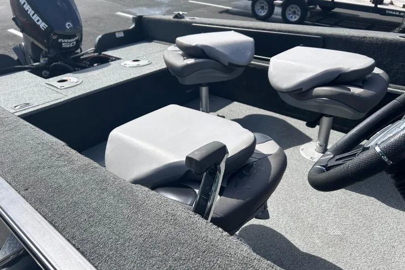 Slide: The Image of 2019 Starweld Fusion Pro 16 SC boat interior with seating and steering wheel. - 9