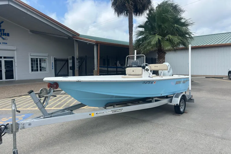 Slide: The Image of 2022 Sea Pro 172 Bay boat on trailer, parked outside a marine facility. - 1