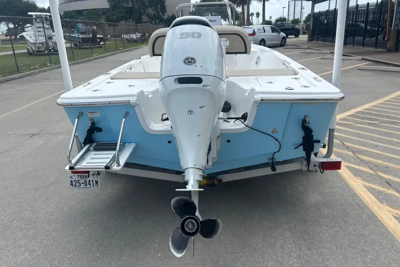Slide: The Image of 2022 Sea Pro 172 Bay boat with outboard motor, parked on a trailer. - 4