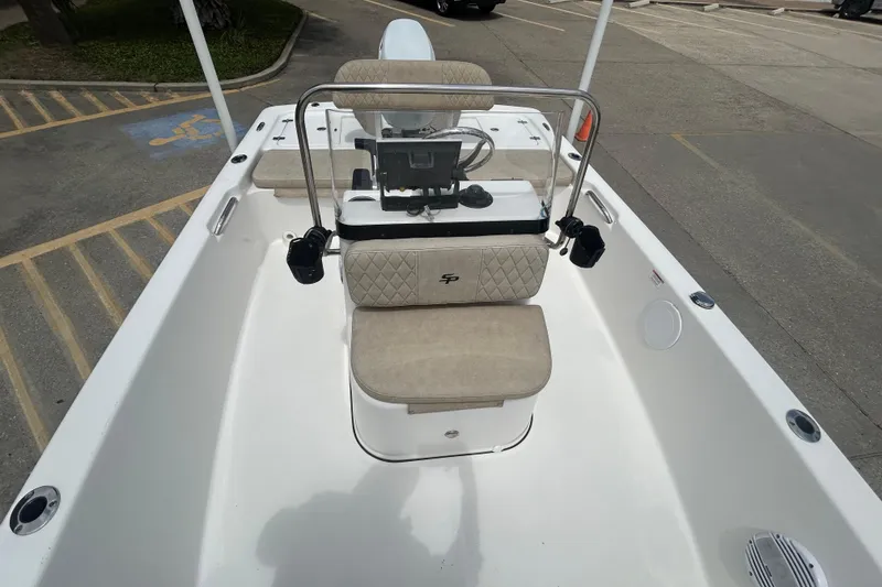 Slide: The Image of 2022 Sea Pro 172 Bay boat interior with beige seating and console. - 8