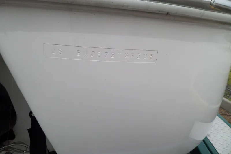 Slide: The Image of 2005 Tahoe Q4 Sport boat hull with visible identification number. - 11