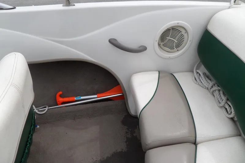 Slide: The Image of Interior of a 2005 Tahoe Q4 Sport boat with seating and safety equipment. - 14