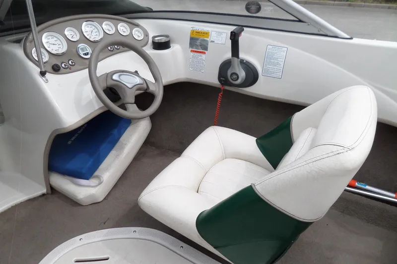 Slide: The Image of 2005 Tahoe Q4 Sport boat interior with steering wheel and gauges. - 15