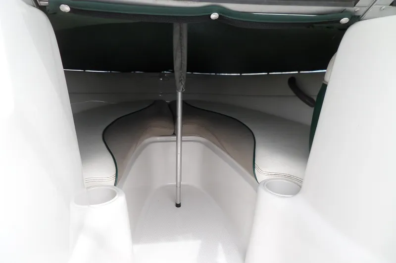 Slide: The Image of Interior view of a 2005 Tahoe Q4 Sport boat, featuring seating and cup holders. - 22