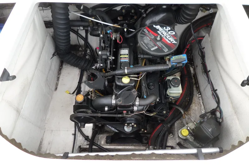 Slide: The Image of Engine compartment of a 2005 Tahoe Q4 Sport boat with Mercury 3.0L motor. - 26
