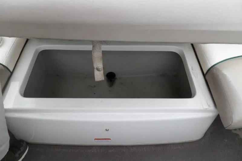 Slide: The Image of Open storage compartment in 2005 Tahoe Q4 Sport boat. - 29